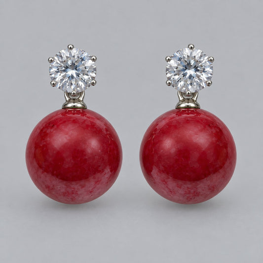 Front view of cherry red orb drop earrings with sparkling round top stones