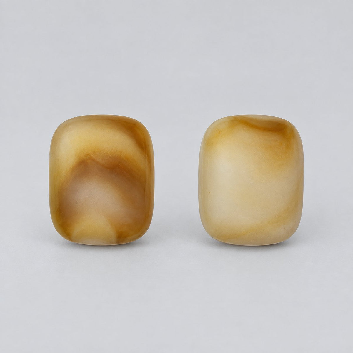 Front view of Amber Glow Cabochon Studs showing the glossy amber and honey cushion cabochon