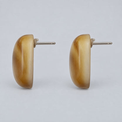 Side view of Amber Glow Cabochon Studs showing the domed profile and push-back post