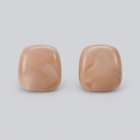 Front view of Apricot Blush Cabochon Studs showing the glossy apricot blush cushion cabochon