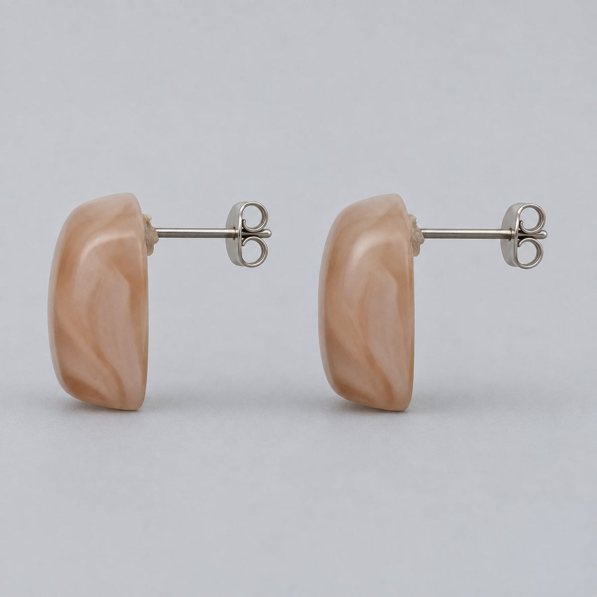 Side view of Apricot Blush Cabochon Studs showing the domed profile and push-back post