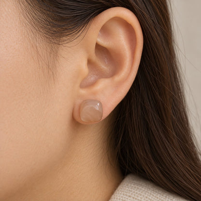 Model wearing Apricot Blush Cabochon Studs cushion cabochon stud earrings