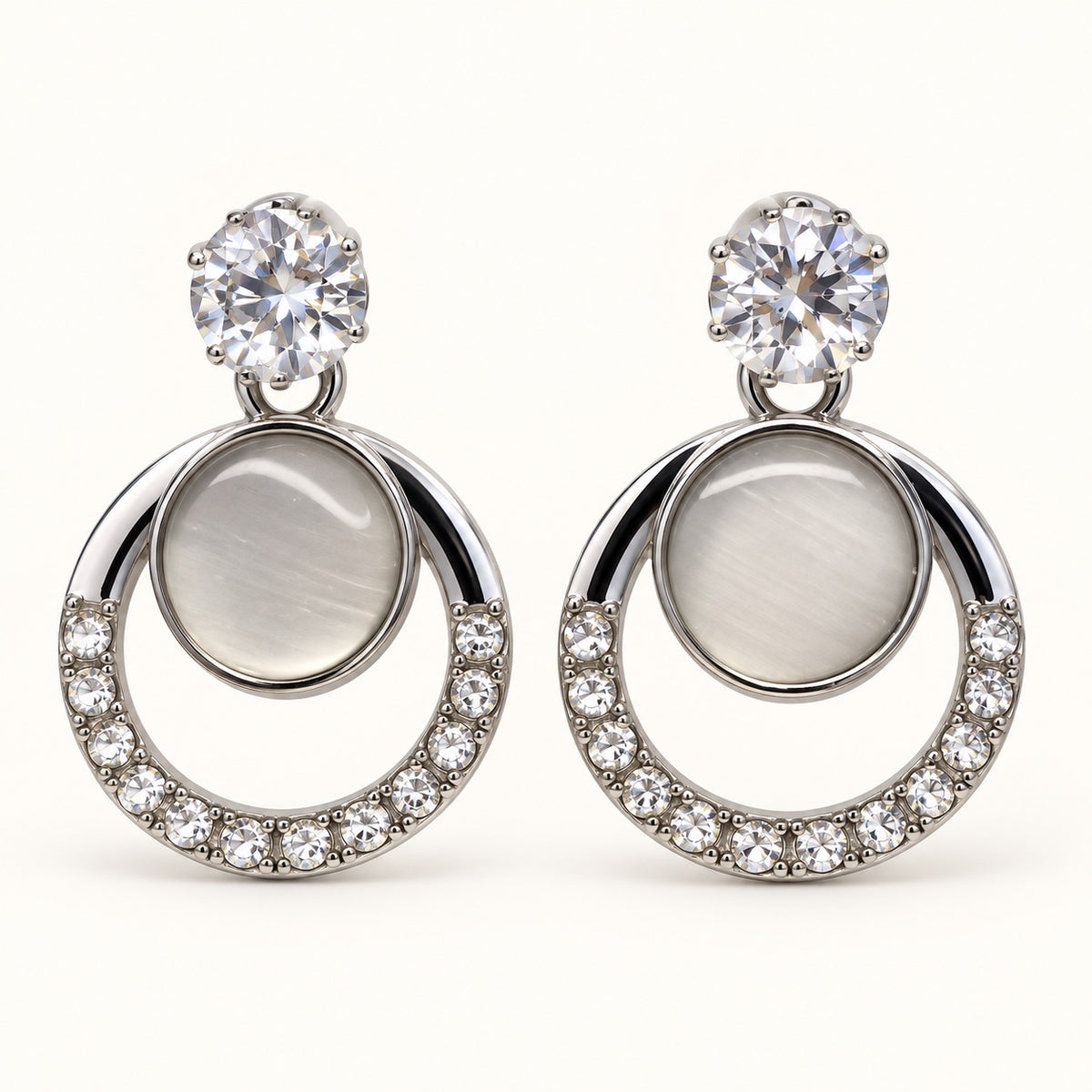 Front view of Argent Opaline Orbit Drops showing the crystal-edged round frame