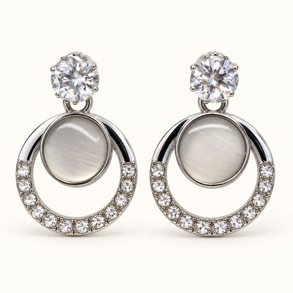 Front view of Argent Opaline Orbit Drops showing the crystal-edged round frame
