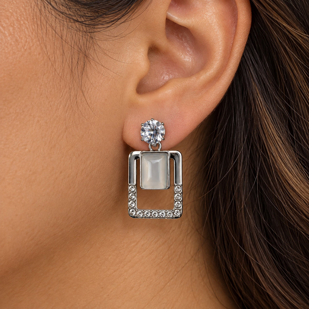 Model wearing Argent Opaline Square Drops silver-tone drop earrings