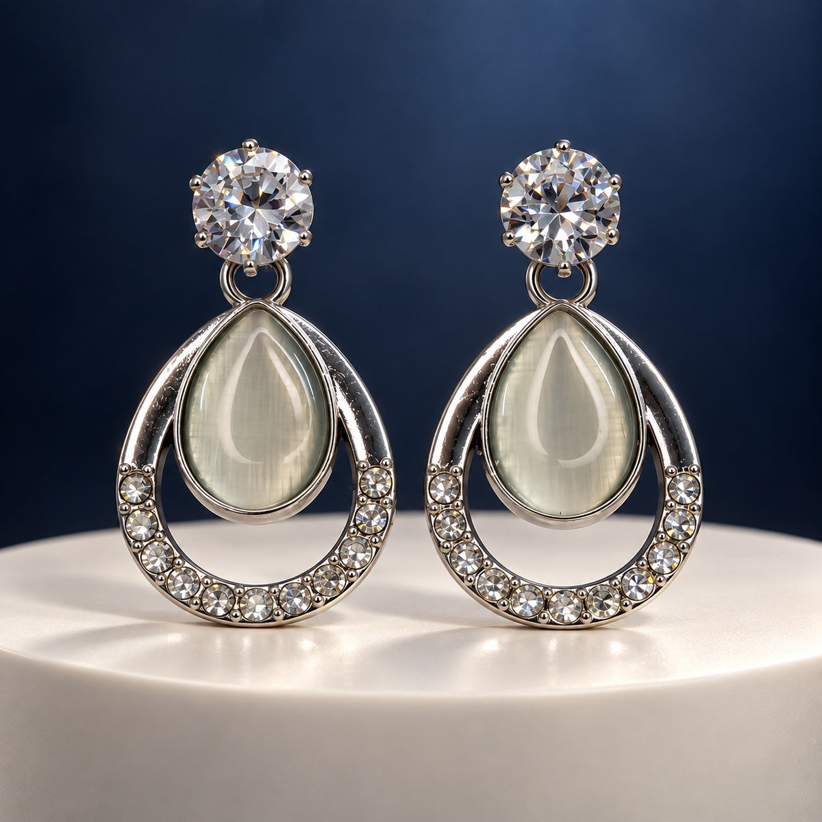 Argent Opaline Teardrop Drops silver-tone earrings with sparkling top stone and opaline teardrop on a pedestal