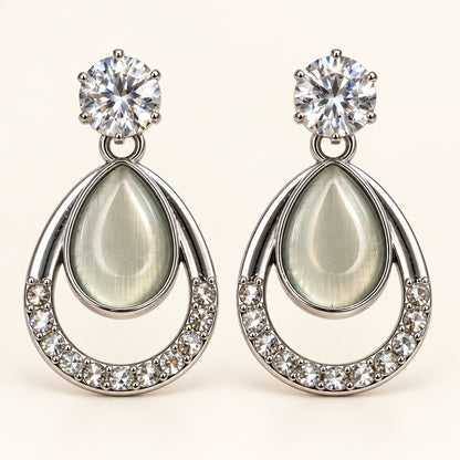 Front view of silver-tone opaline teardrop drop earrings with crystal-lined frame