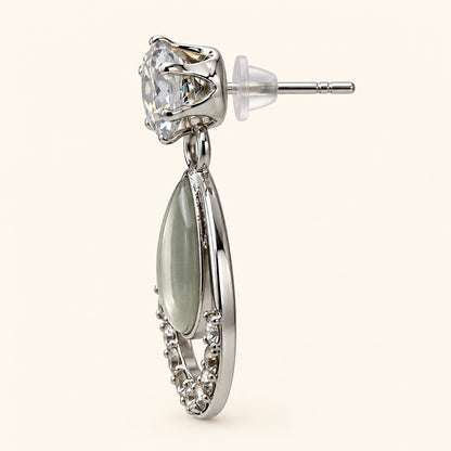 Side view of silver-tone opaline teardrop drop earrings showing the drop profile and push-back post
