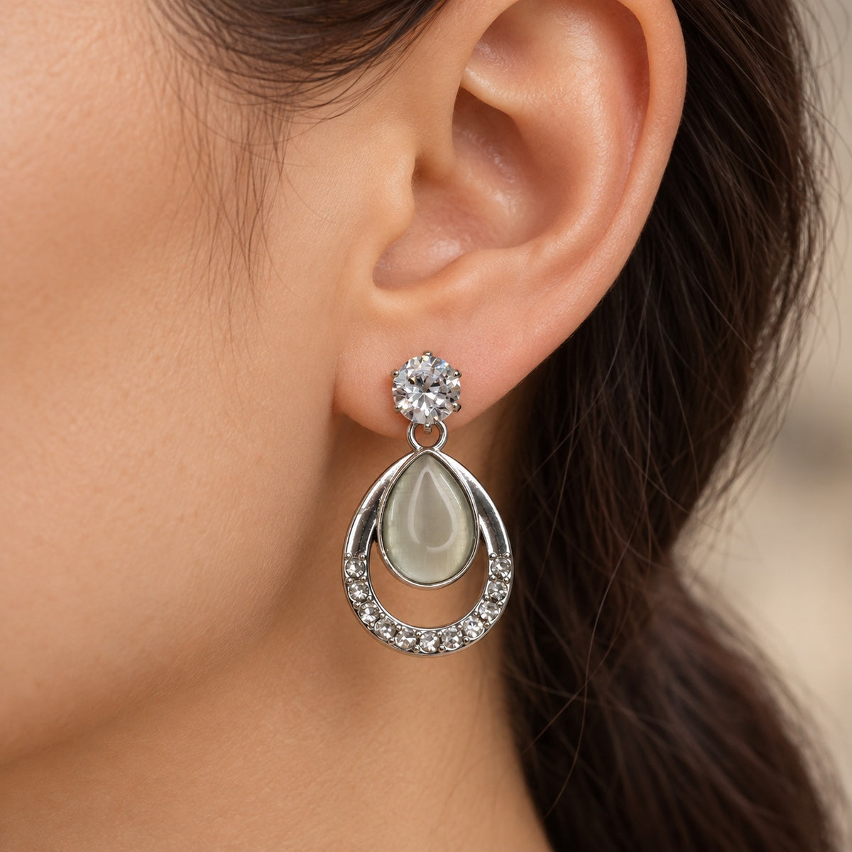 Model wearing Argent Opaline Teardrop Drops silver-tone earrings
