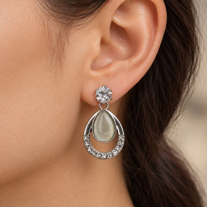 Model wearing Argent Opaline Teardrop Drops silver-tone earrings