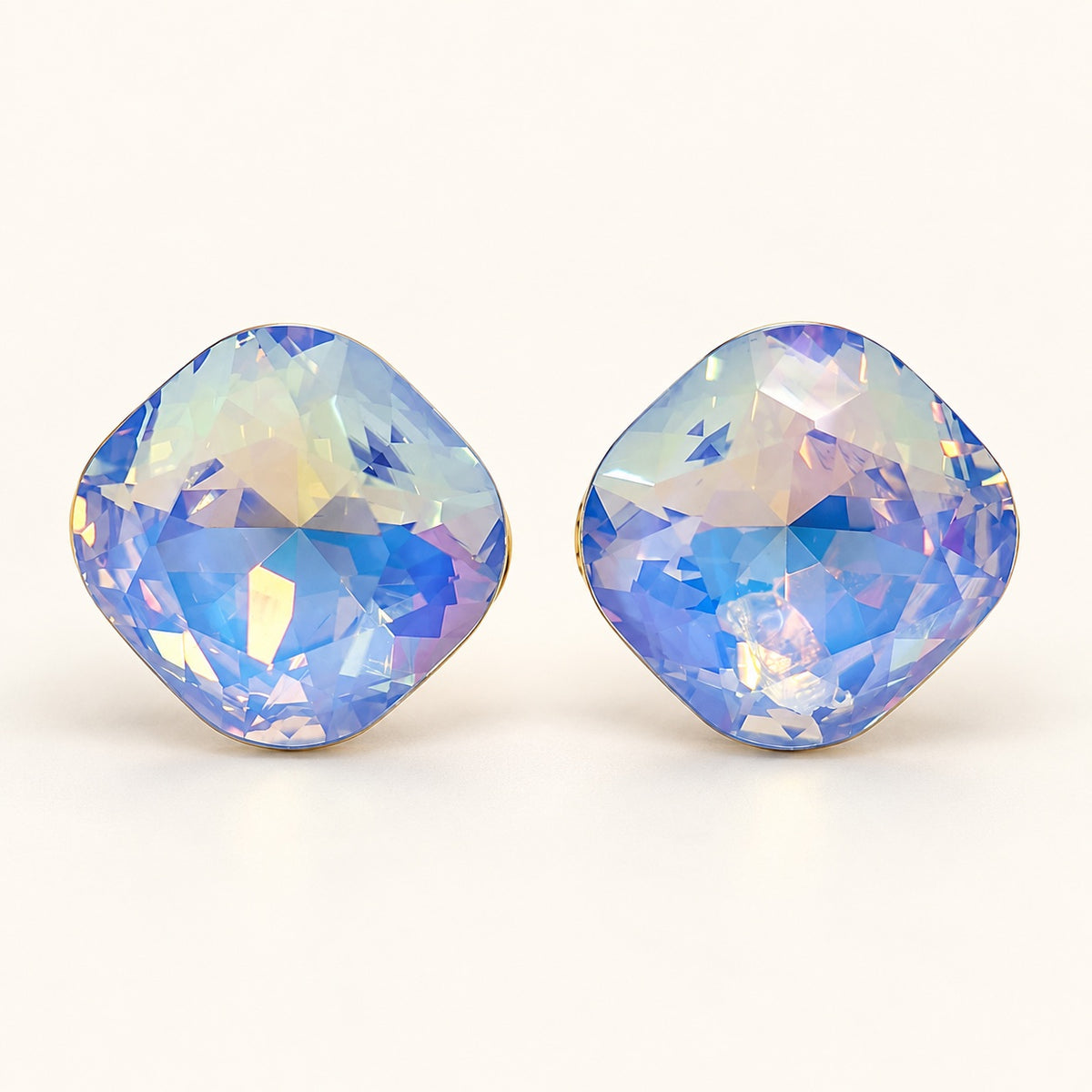 Front view of iridescent blue cushion crystal stud earrings