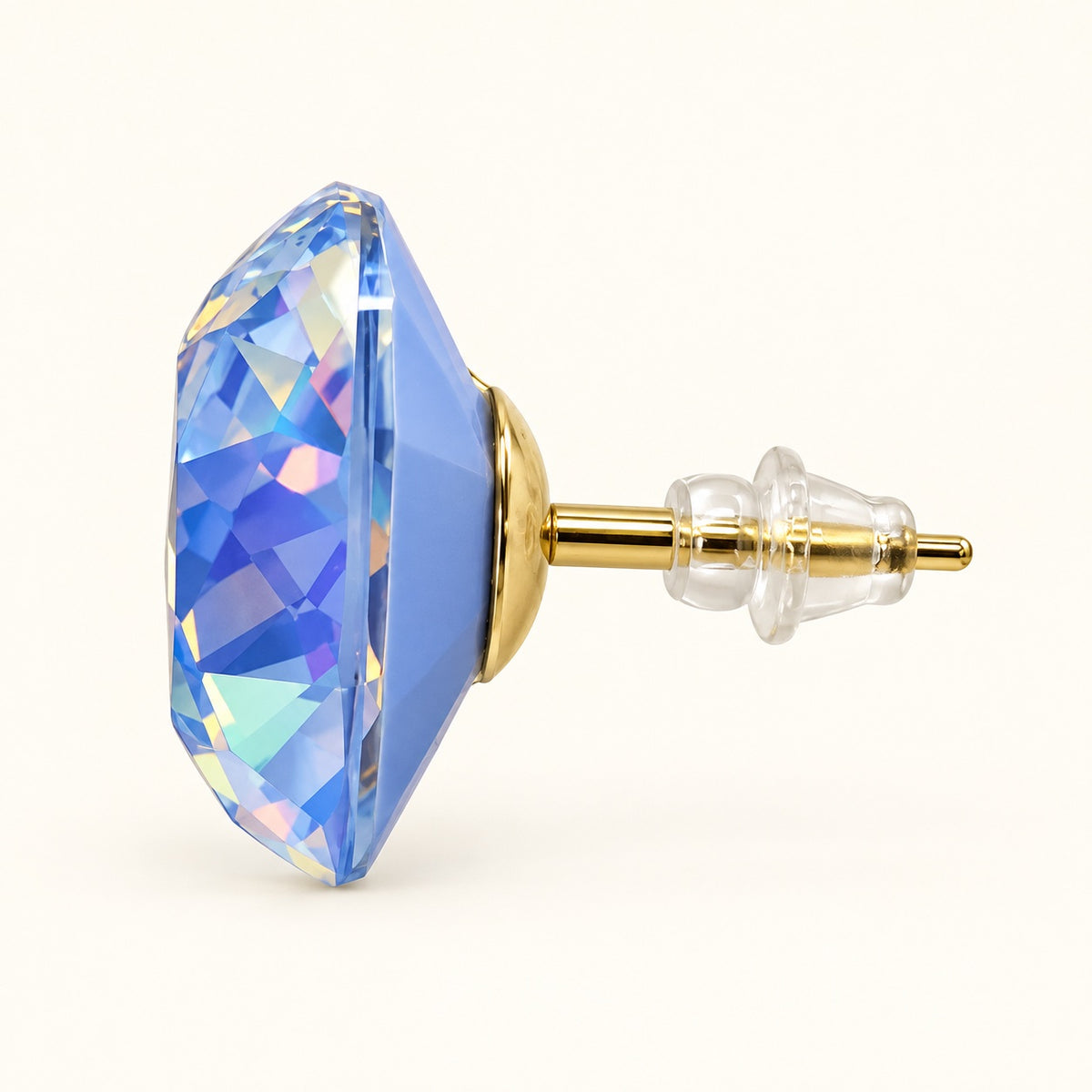 Side view of blue cushion crystal stud earrings showing gold-tone post