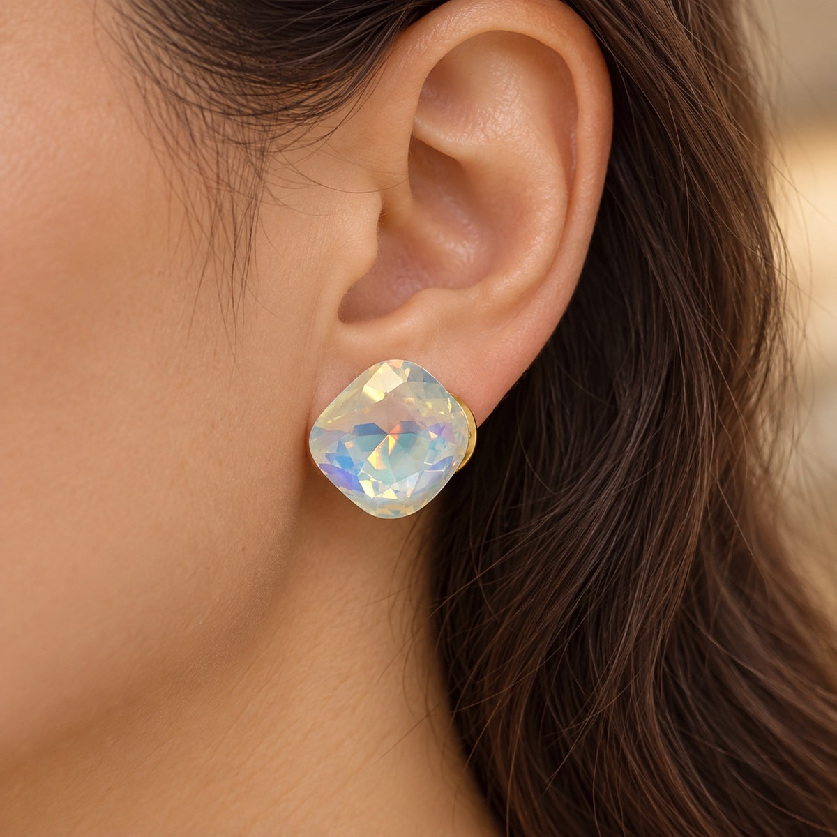 Model wearing Aurora White Crystal Studs pearly stud earrings