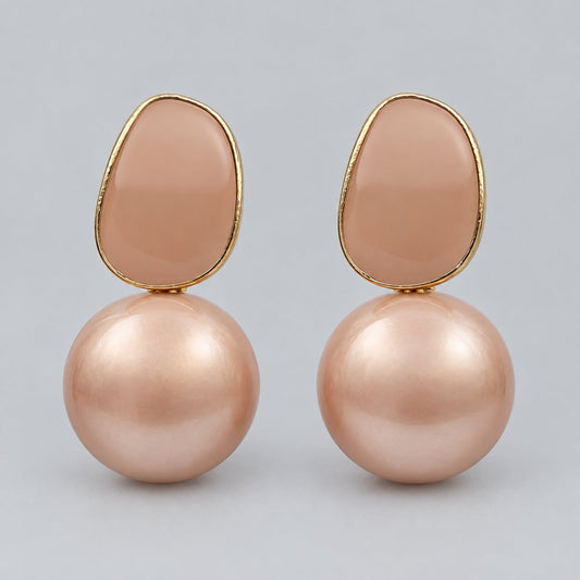Front view of blush pebble faux pearl drop earrings with gold-tone frame