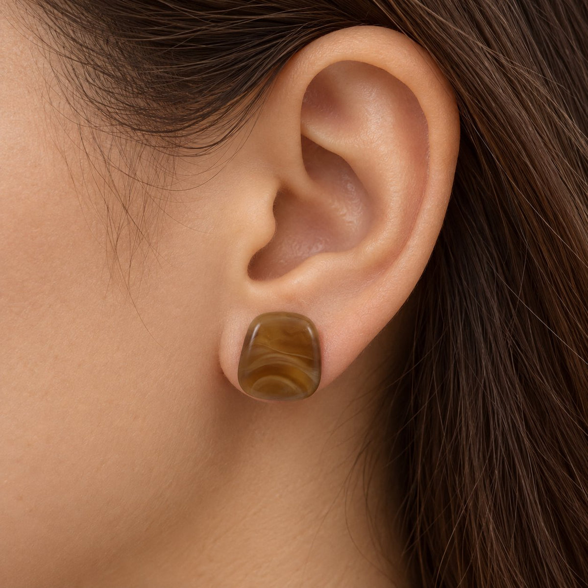 Model wearing Chestnut Cabochon Studs marbled stud earring