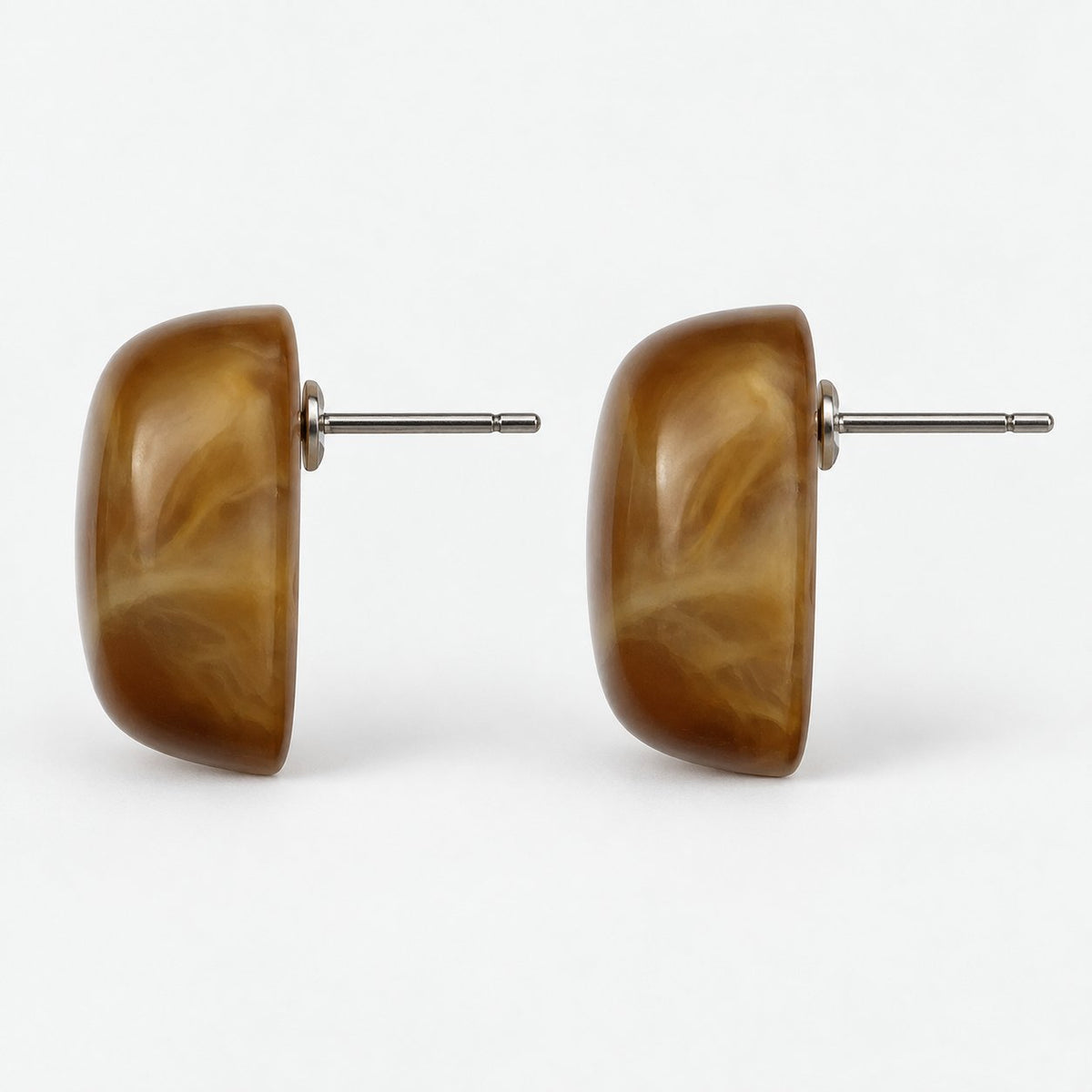 Side view of cognac cabochon stud earrings showing the silver-tone post