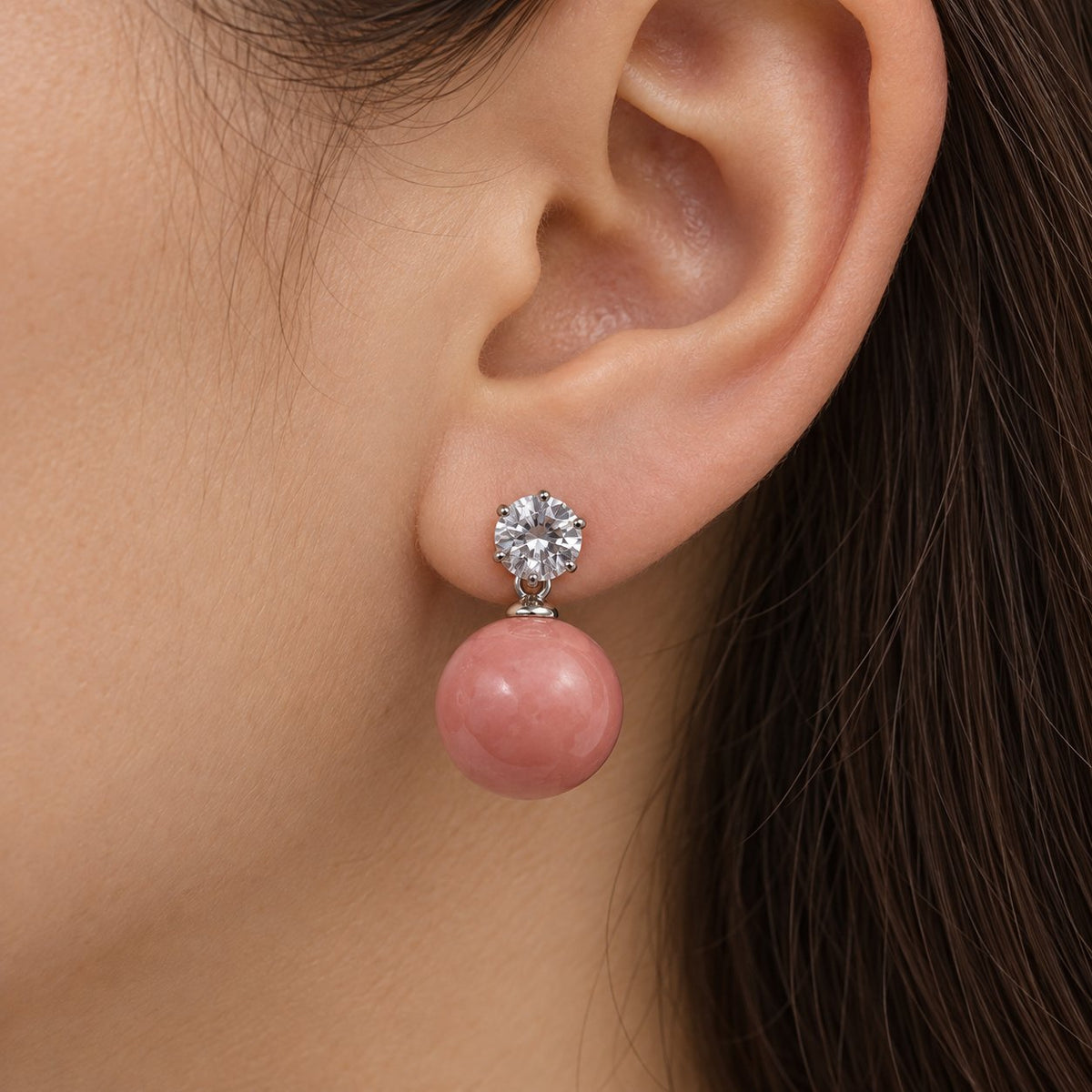 Model wearing Coral Pink Lustre Orb Drops silver-tone earrings