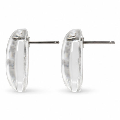 Side view of crystal clear cabochon stud earrings showing the domed profile and post