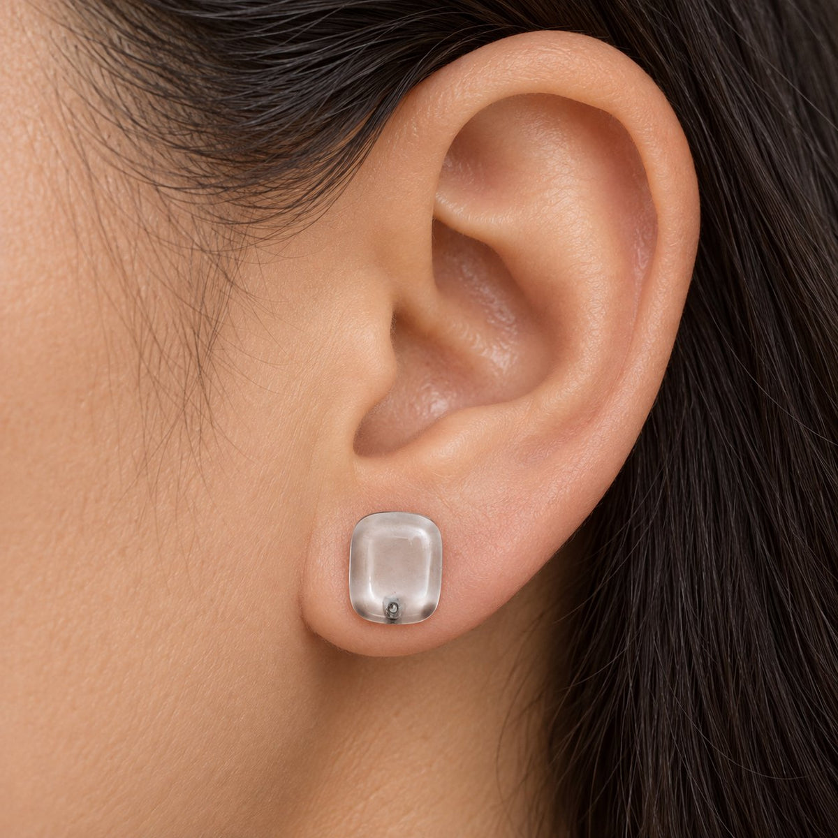 Model wearing Crystal Clear Cabochon Studs transparent stud earrings