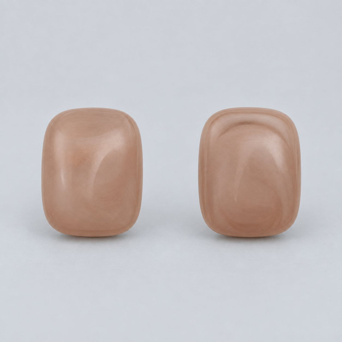 Front view of dusty rose cushion cabochon stud earrings
