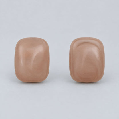 Front view of dusty rose cushion cabochon stud earrings