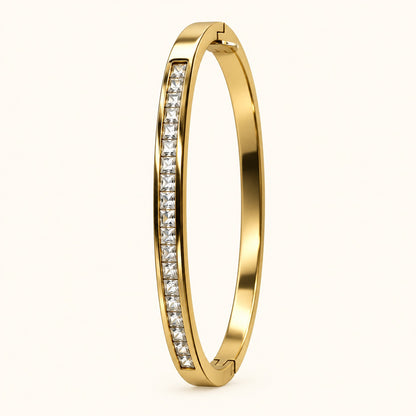 Side view of gilded channel-set CZ bangle showing the hinge and slim profile
