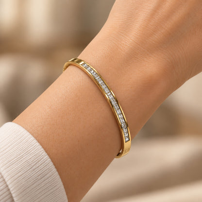 Model wearing Gilded Channel-Set CZ Bangle gold-tone bangle