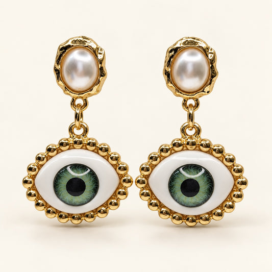Front view of Gilded Evil Eye Pearl Drops gold-tone evil eye pearl drop earrings