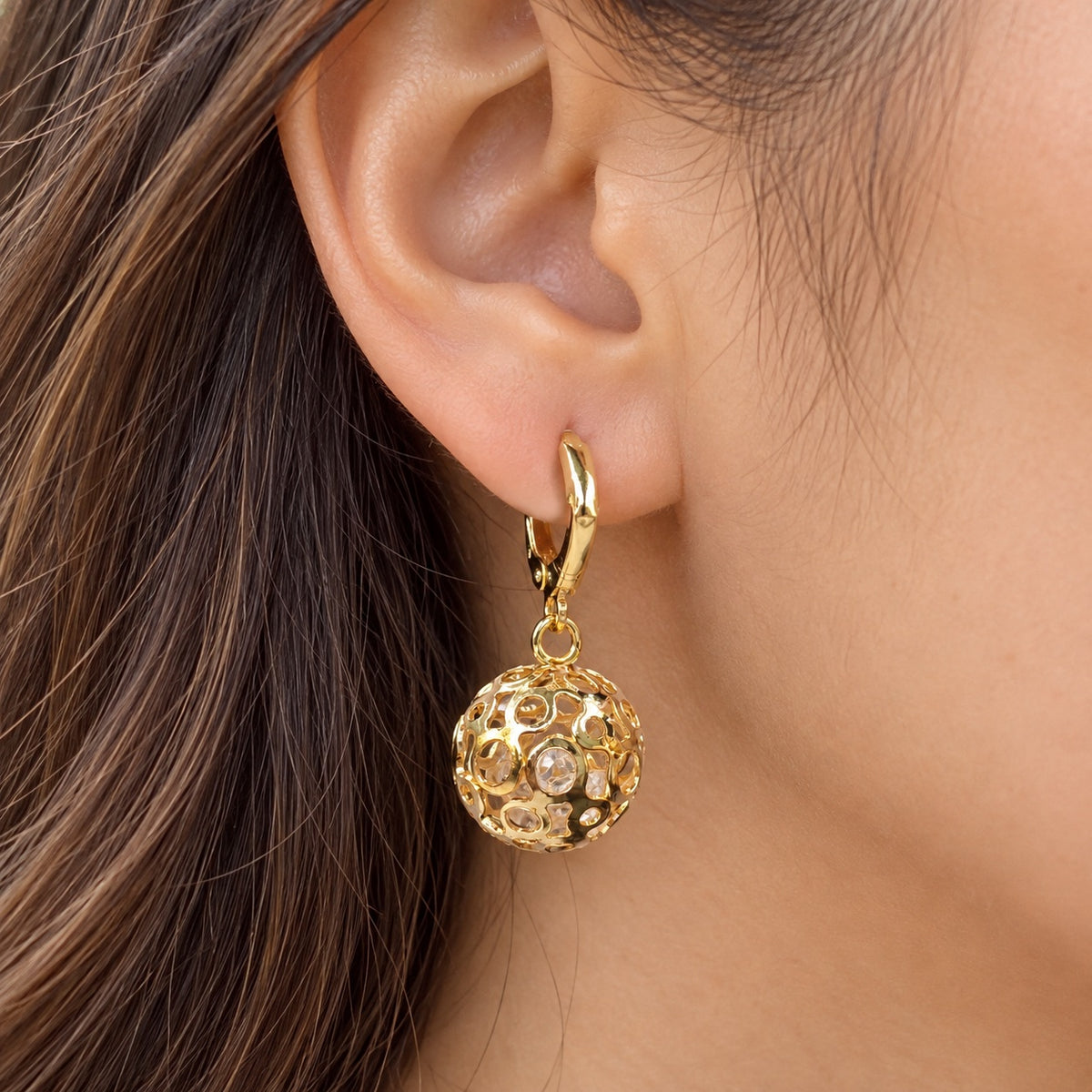 Gilded Filigree Orb Huggie Drops gold-tone filigree orb huggie drop earrings worn on model