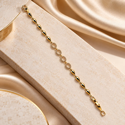 Gilded Marquise Link Bracelet gold-tone oval link bracelet styled on cream marble