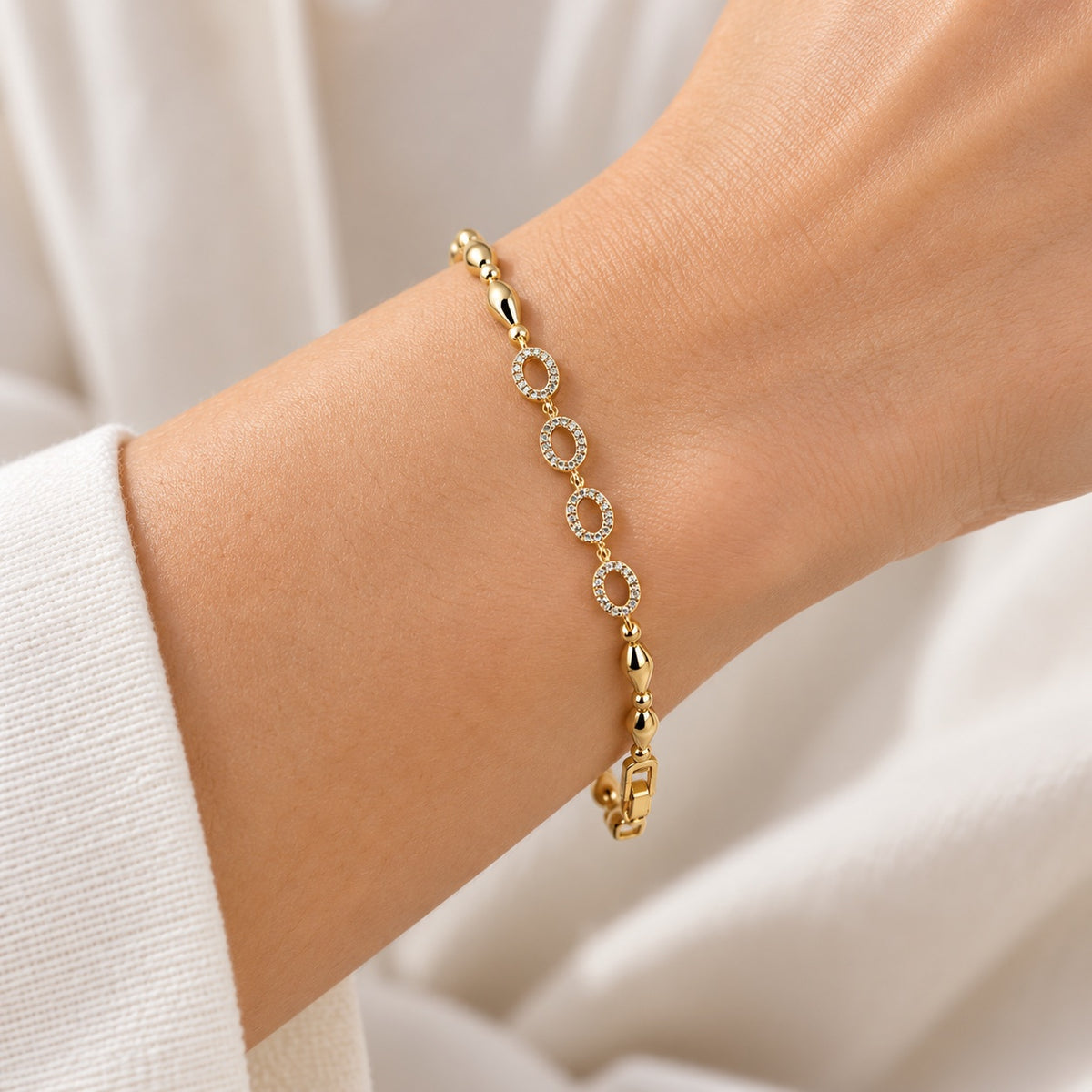 Gilded Marquise Link Bracelet gold-tone oval link bracelet worn on model