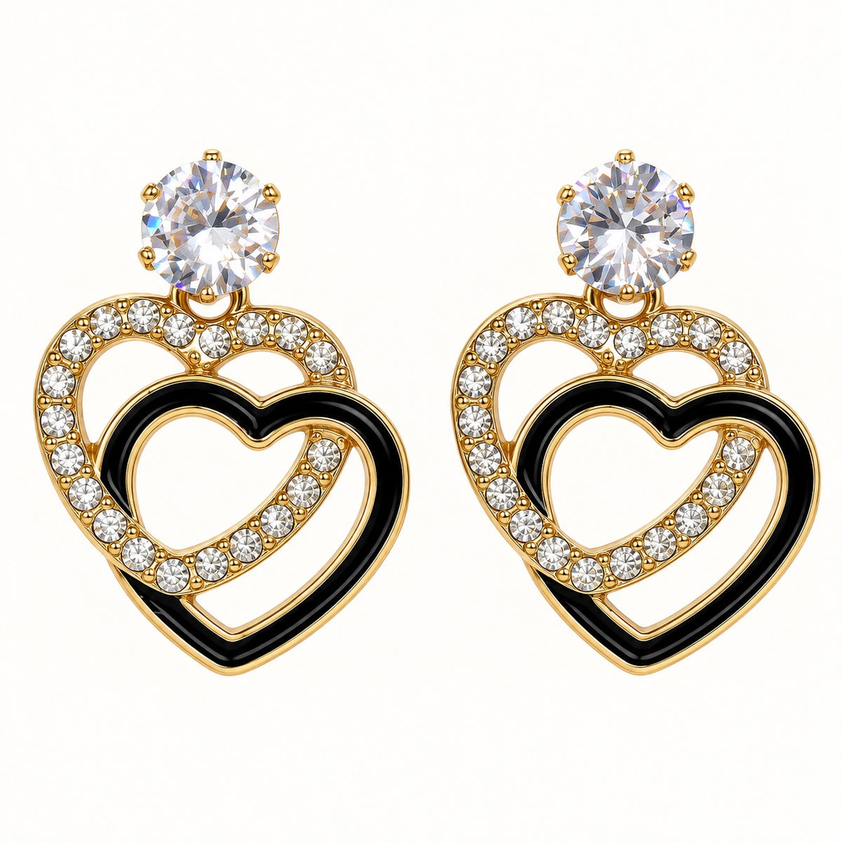 Front view of Gilded Noir Heart Drops gold-tone heart drop earrings
