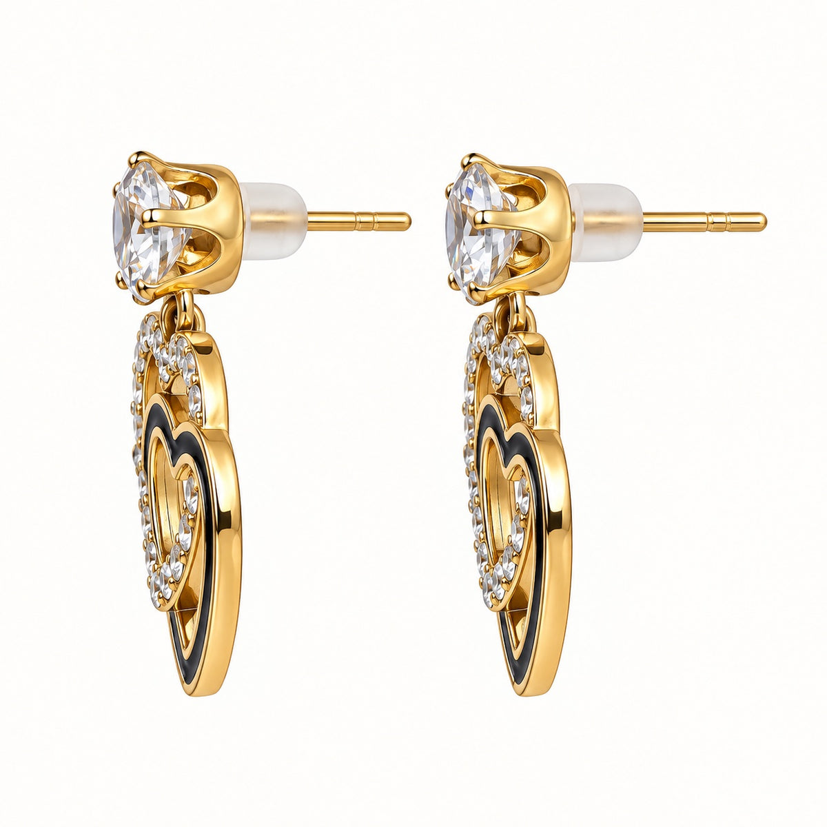 Side view of Gilded Noir Heart Drops gold-tone heart drop earrings