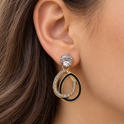 Gilded Noir Teardrop Earrings gold-tone teardrop earrings worn on model