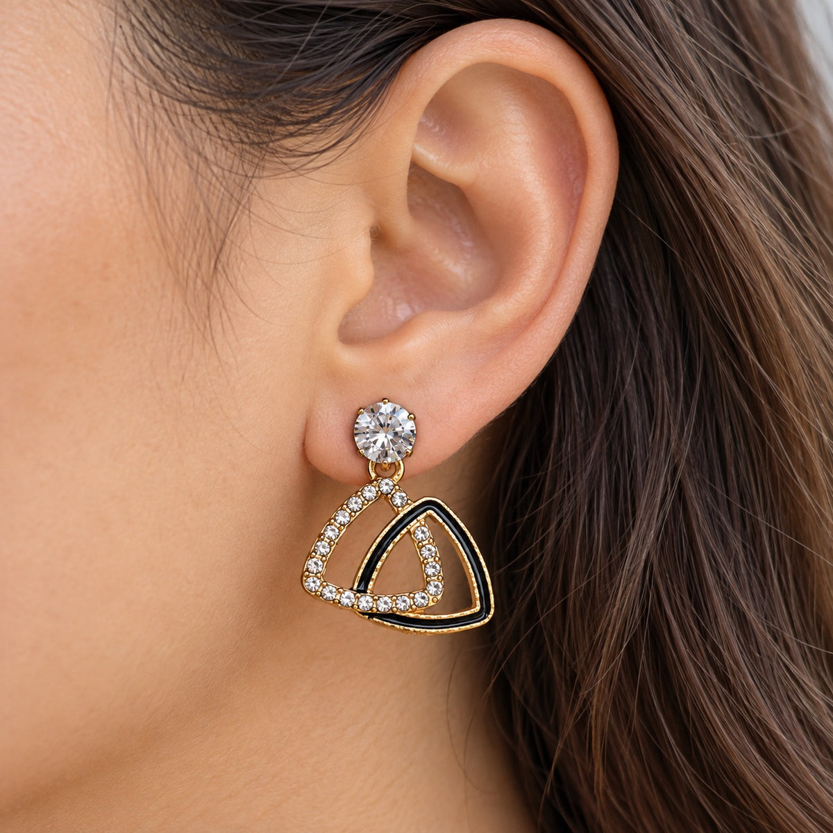 Gilded Noir Trillion Drops gold-tone trillion drop earrings worn on model