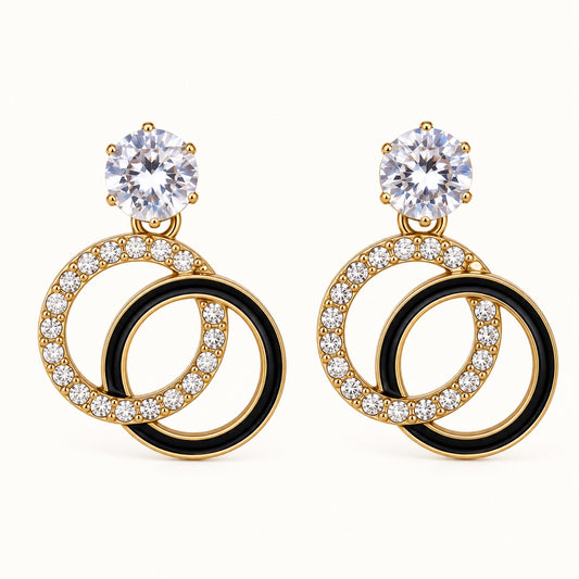 Front view of Gilded Noir Twin Orbit Drops gold-tone twin orbit drop earrings