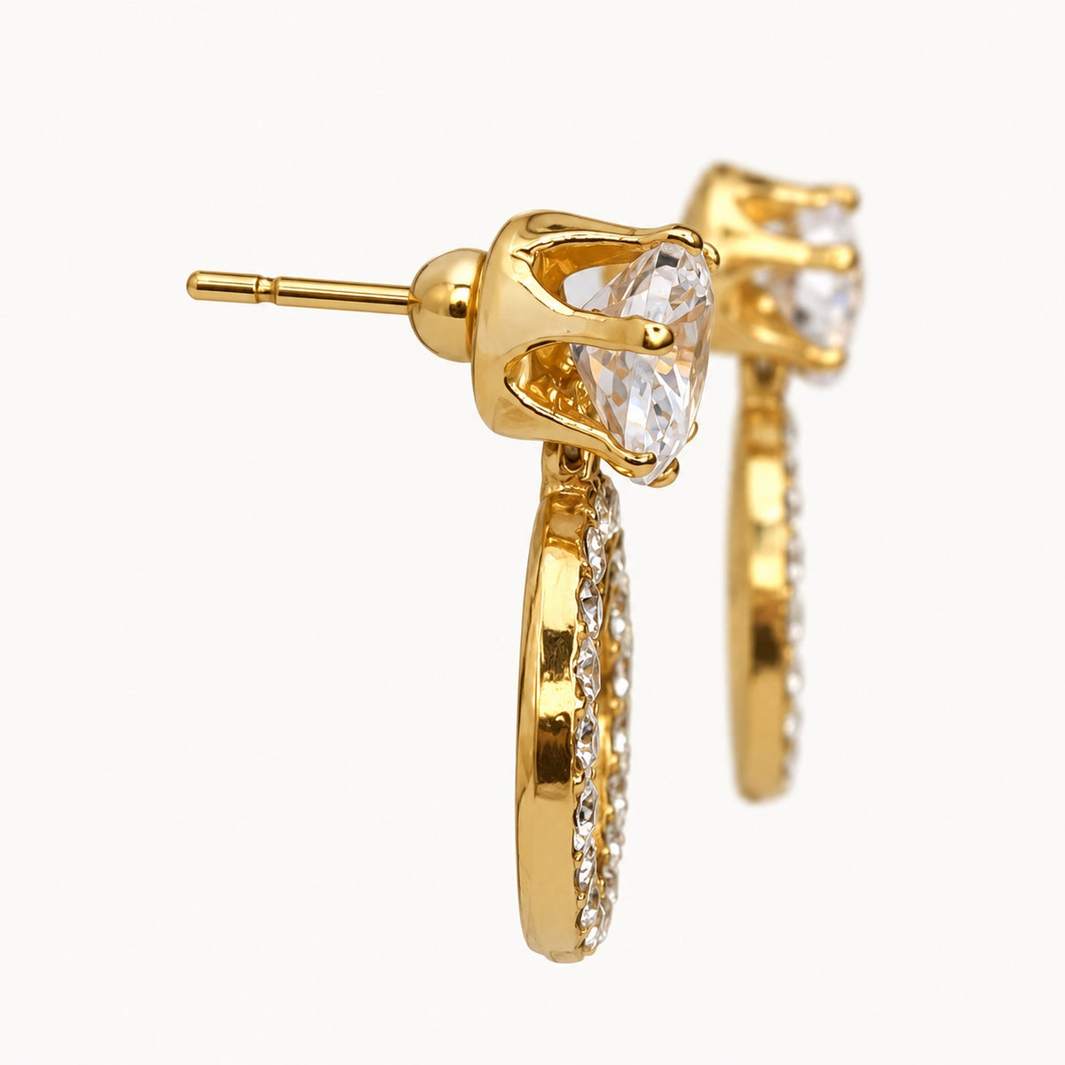 Side view of Gilded Noir Twin Orbit Drops gold-tone twin orbit drop earrings