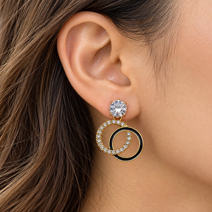 Gilded Noir Twin Orbit Drops gold-tone twin orbit drop earrings worn on model