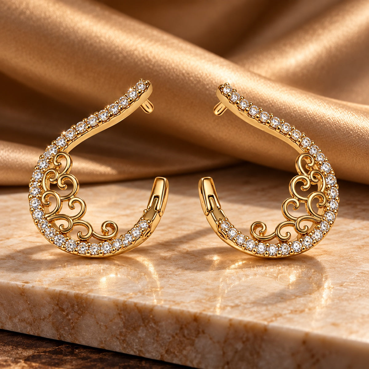 Gilded Pave Ear Climbers gold-tone pave ear climber earrings styled on cream marble