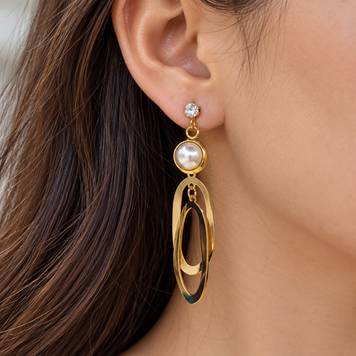Gilded Pearl Oval Loop Drops gold-tone pearl oval loop drop earrings worn on model