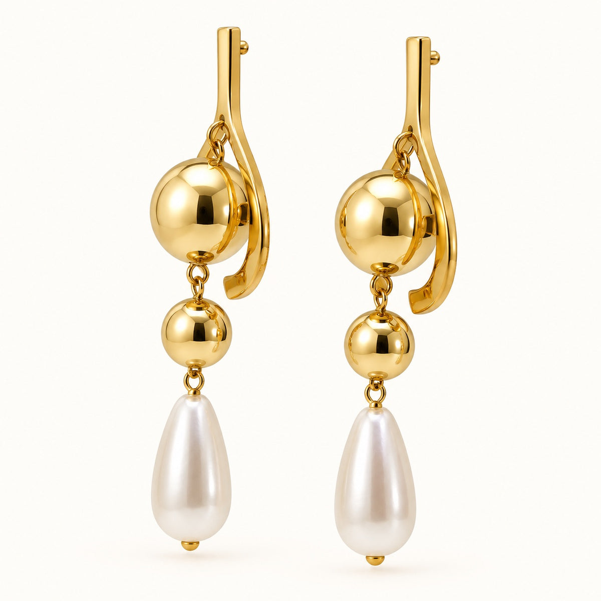 Side view of Gilded Pearl Teardrop Chandeliers gold-tone pearl teardrop chandelier earrings