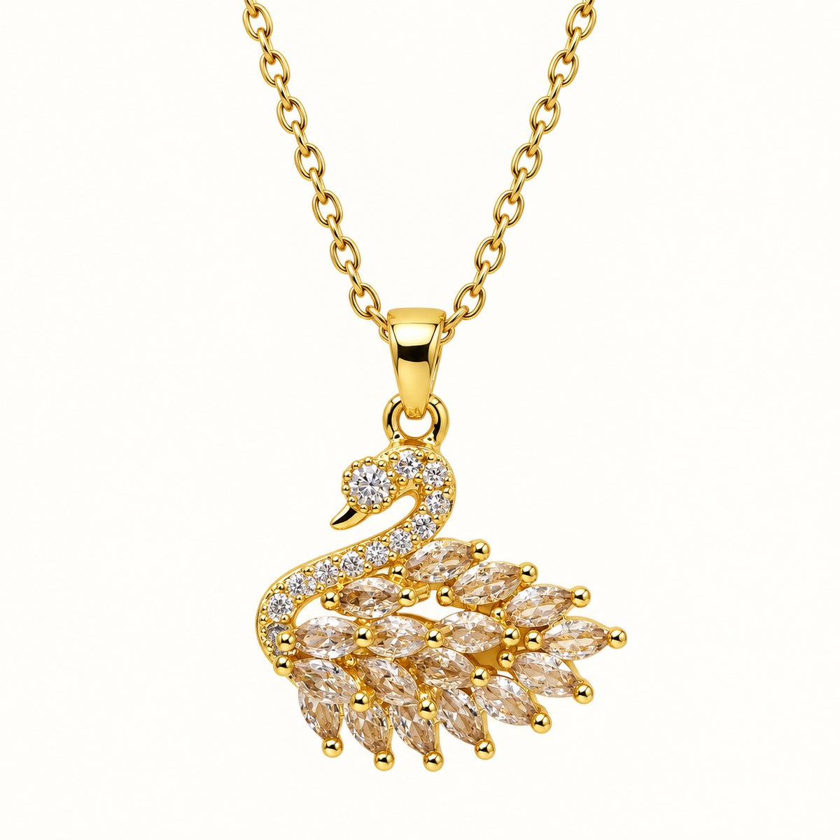 Front view of the gold-tone swan pendant with pavé neck and layered sparkling wing stones