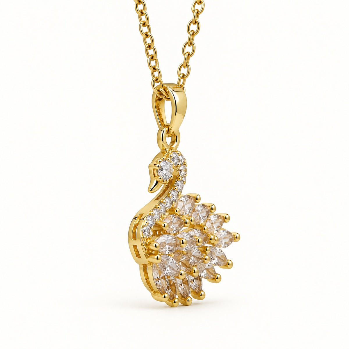 Side view of the swan pendant showing the polished bail and chain link
