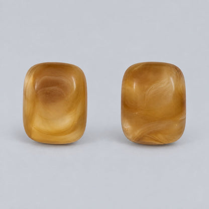 Front view of the golden honey cushion cabochon stud earrings