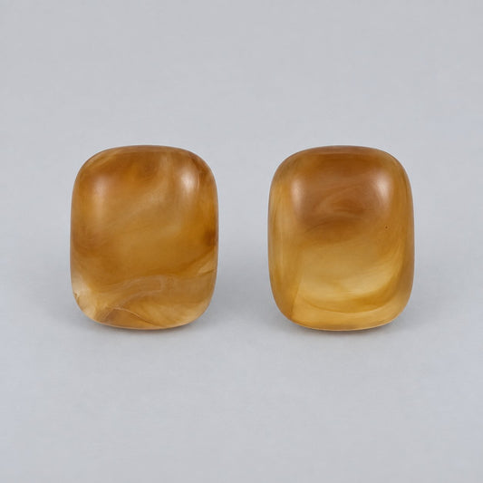 Front view of the honey gold cushion cabochon stud earrings