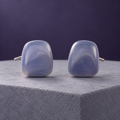 Lavender Mist Cabochon Studs with smoky lavender marbled stones on a marble ledge