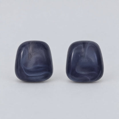 Front view of the midnight blue cabochon stud earrings