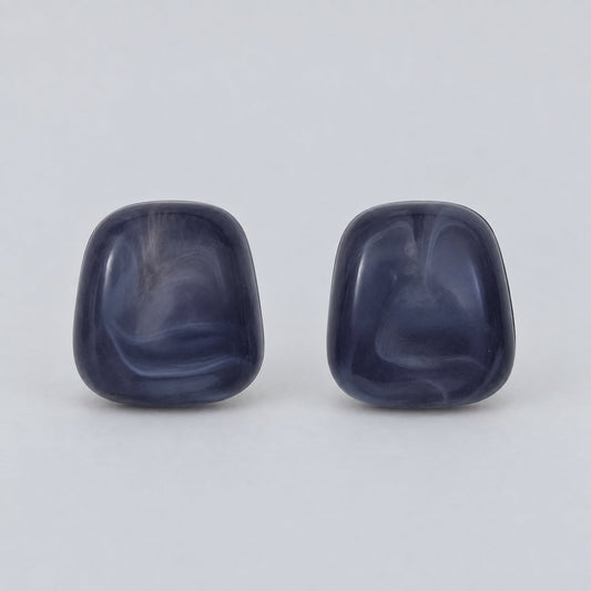 Front view of the midnight blue cabochon stud earrings