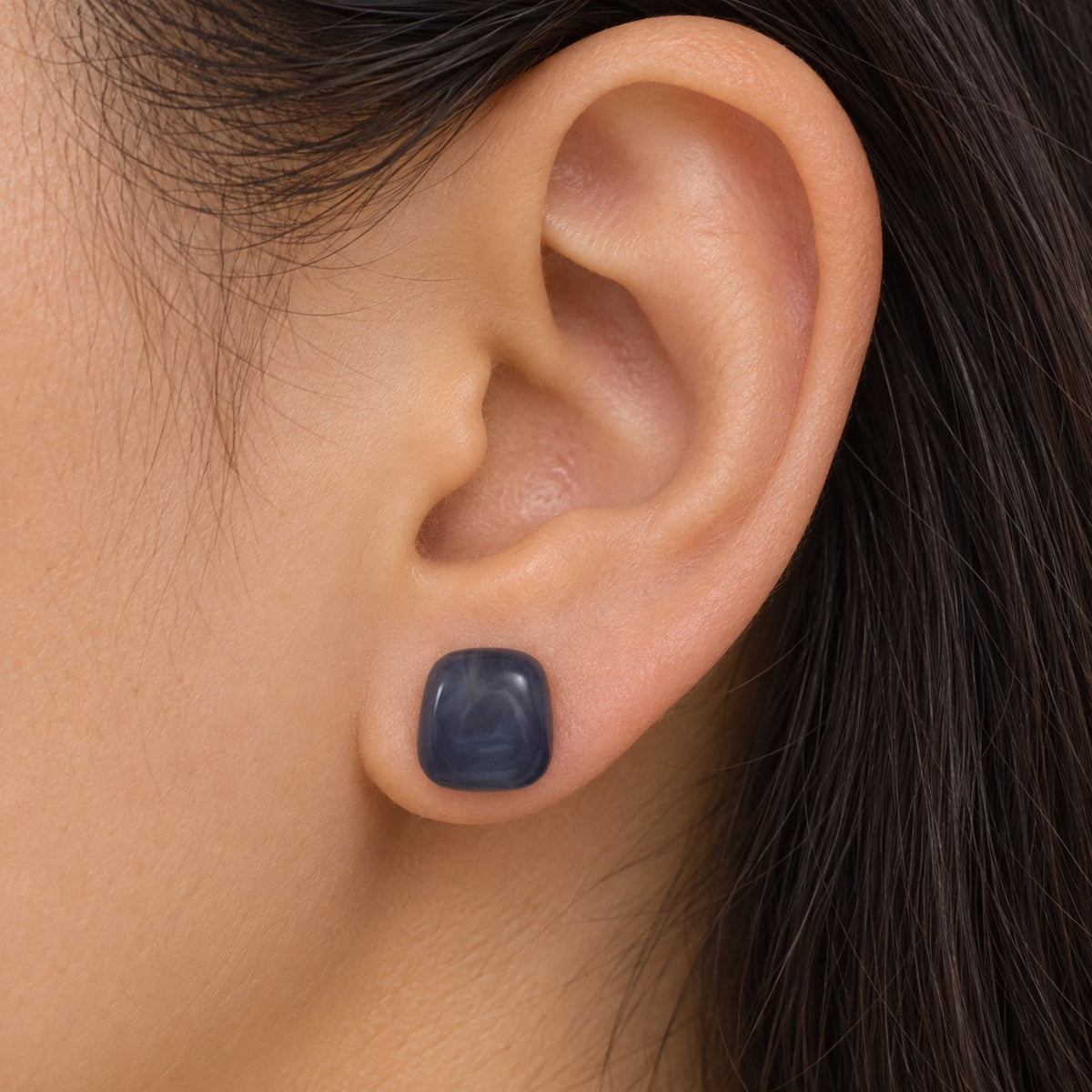 Model wearing the Midnight Blue Cabochon Studs