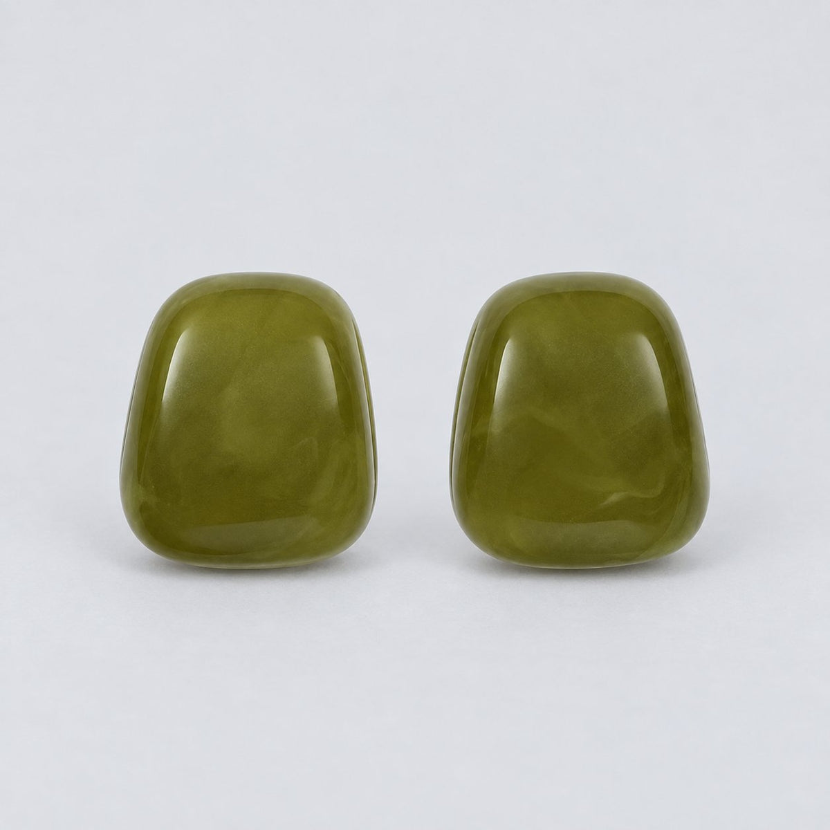 Front view of the moss green cabochon stud earrings